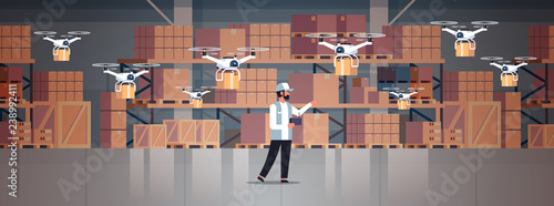 man courier hold wireless remote control parcel drones air delivery modern logistic system fast shipping concept cargo copter mail service warehouse interior horizontal