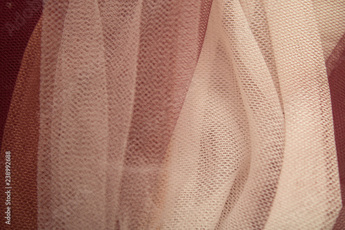 the fabric is of gentle color is gathered by the folds