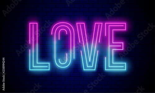Glowing text Love on blue brick wall.