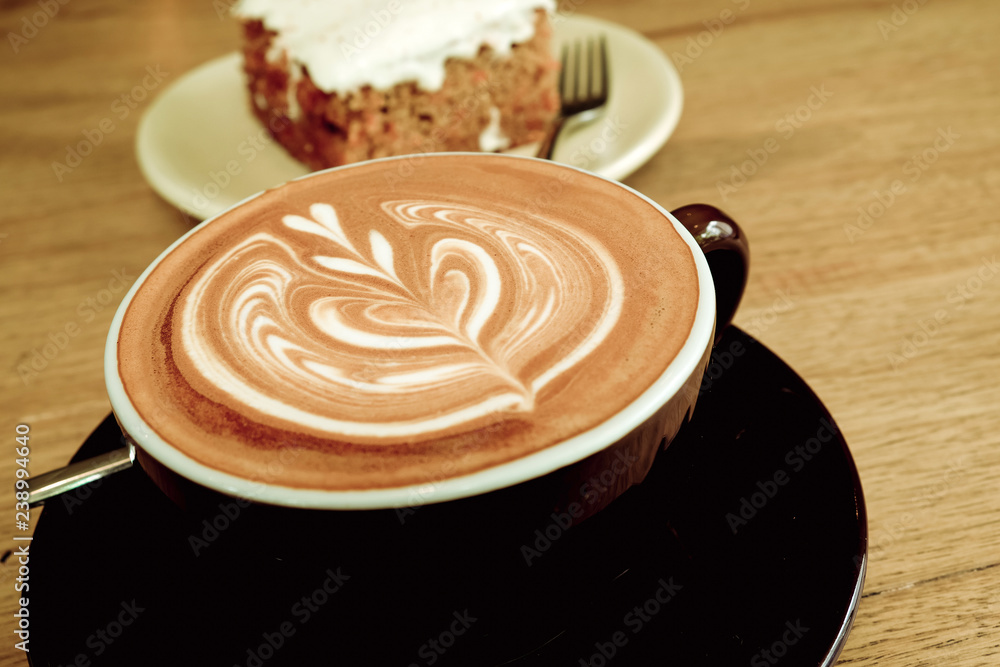 Hot Latte Coffee with Carrot Cheesecake on Wooden Table Hot Latte Coffee with Carrot Cheesecake on Wooden Table