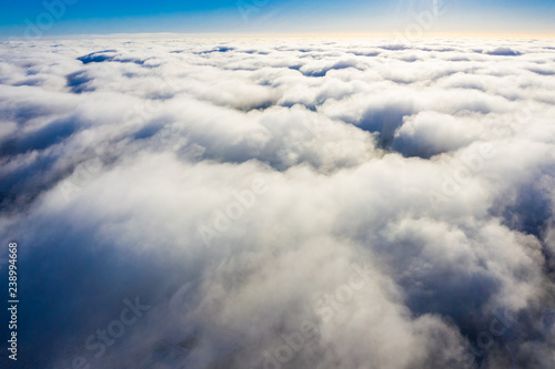 Beautiful cloudscape. Sunny day. Flying above the ground