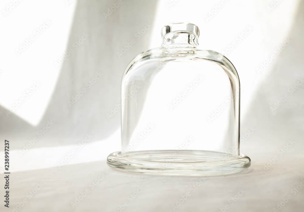 Transparent glass kitchen dome with empty space inside for an object. Clear small food container isolated on white background Transparent glass kitchen dome with empty space inside for an object. Clear small food container isolated on white background