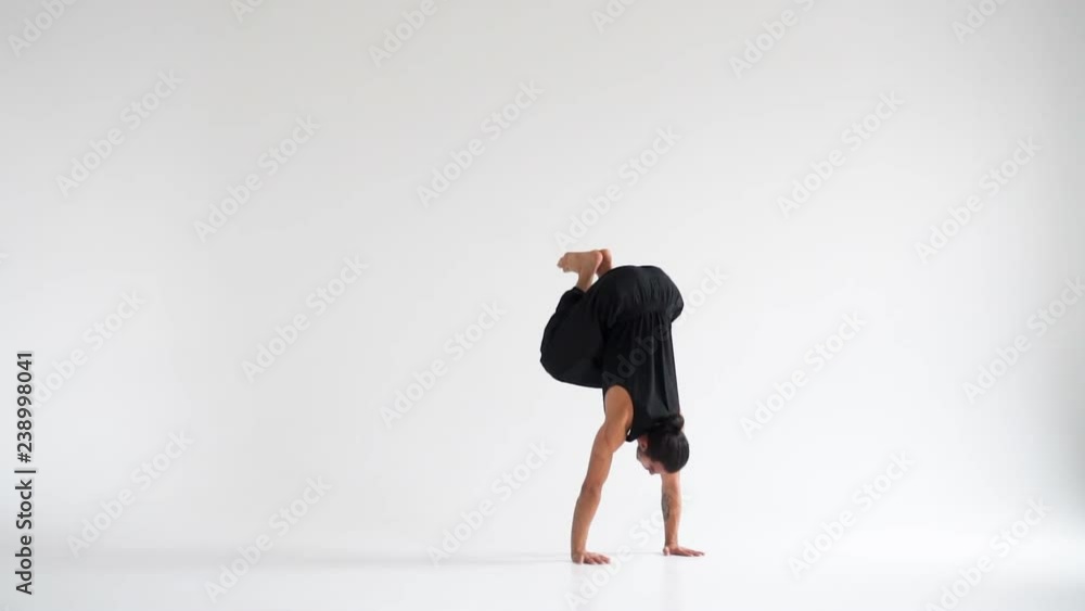 Man practicing intense yoga asana Man practicing intense yoga asana