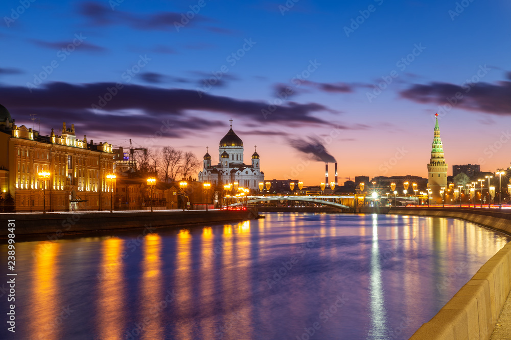 Beautiful sunset on Moskva river embankment with a view of Kremlin wall and Cathedral of Christ the Saviour in Moscow, Russia Beautiful sunset on Moskva river embankment with a view of Kremlin wall and Cathedral of Christ the Saviour in Moscow, Russia