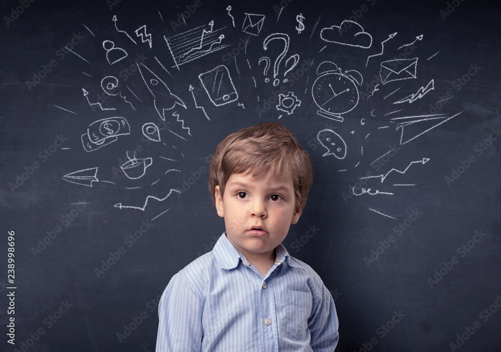 Smart little kid in front of a drawn up blackboard ruminate Smart little kid in front of a drawn up blackboard ruminate