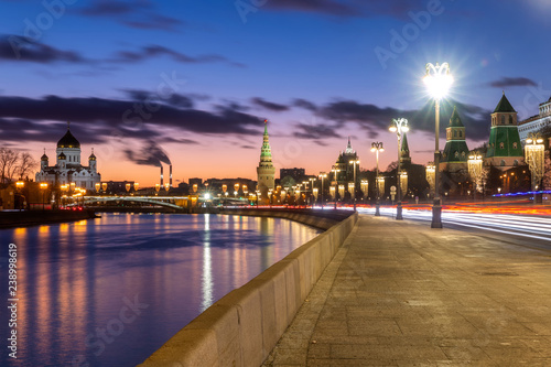 Beautiful sunset on Moskva river embankment with a view of Kremlin wall and Cathedral of Christ the Saviour in Moscow, Russia