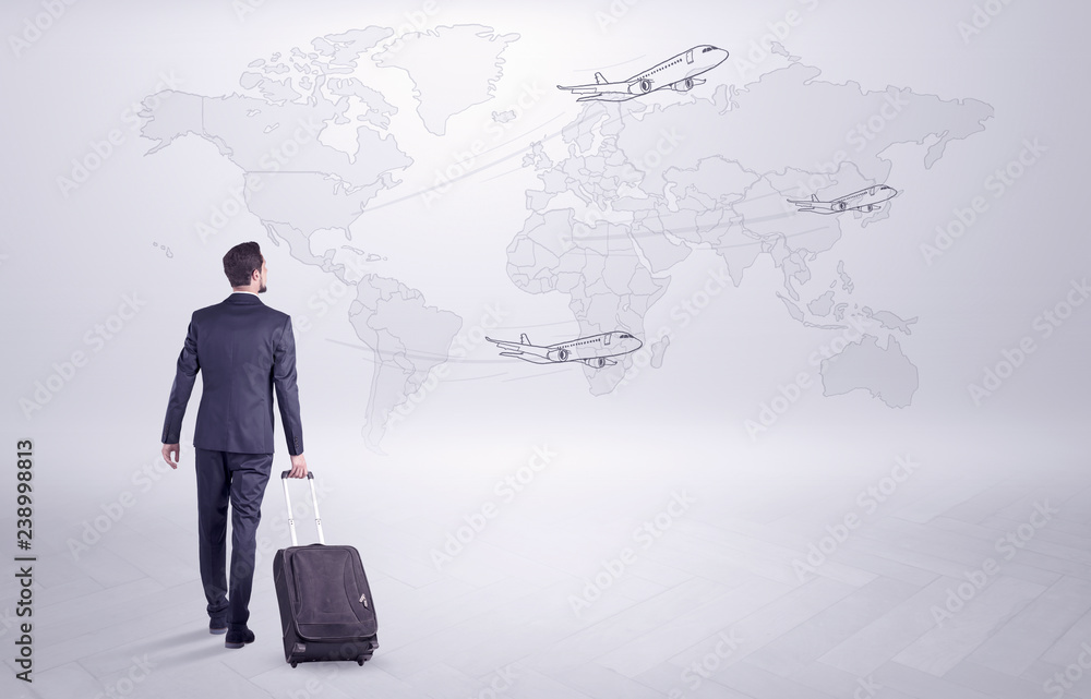 Businessman in dark suit planning his trip in a front of a map
Businessman in dark suit planning his trip in a front of a map