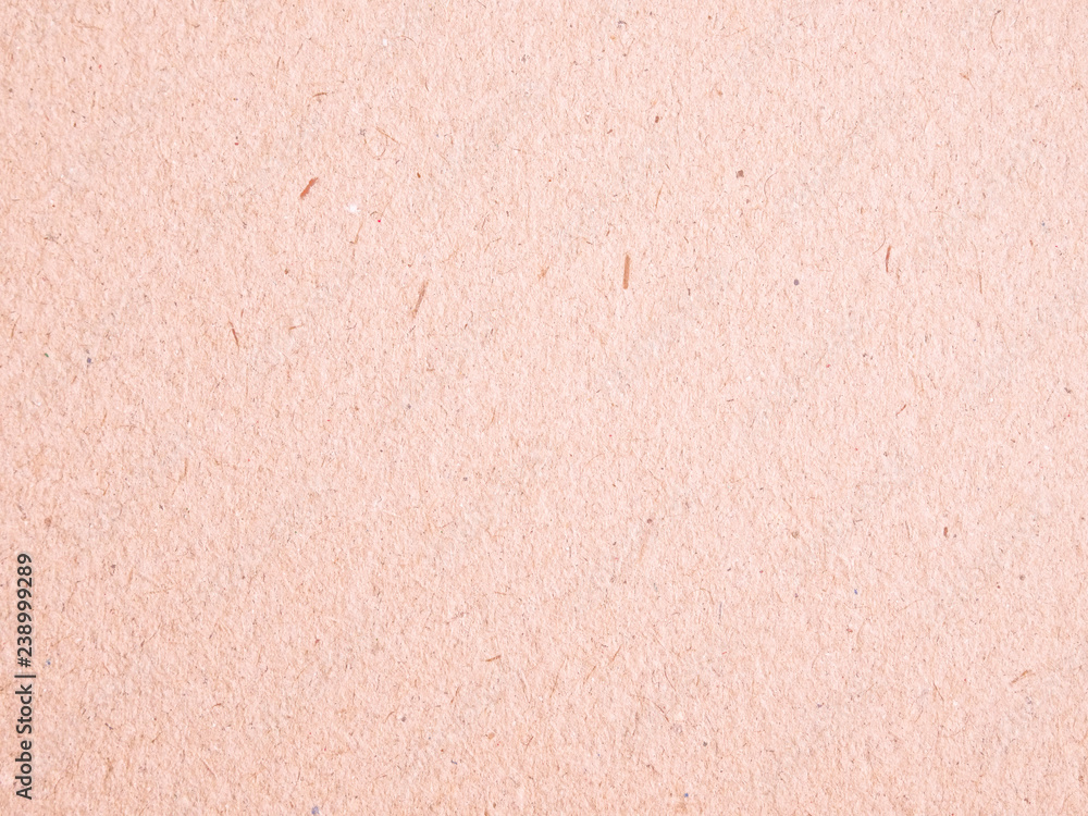 Fototapeta premium Texture of light red cardboard closeup, abstract paper background