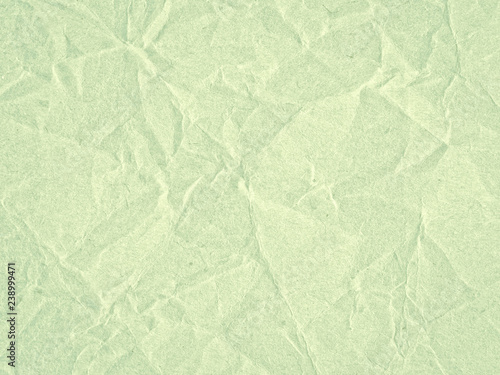 Texture of light green crumpled craft paper. Texture for design, abstract background