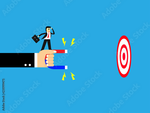 vector of businessman standing on hand holding magnetic,Magnetism is absorbing the target,business concept