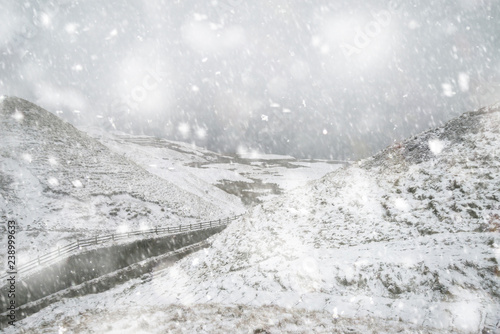 Beautiful Winter landscape image around Mam Tor countryside in Peak District England in heavy snow storm © veneratio