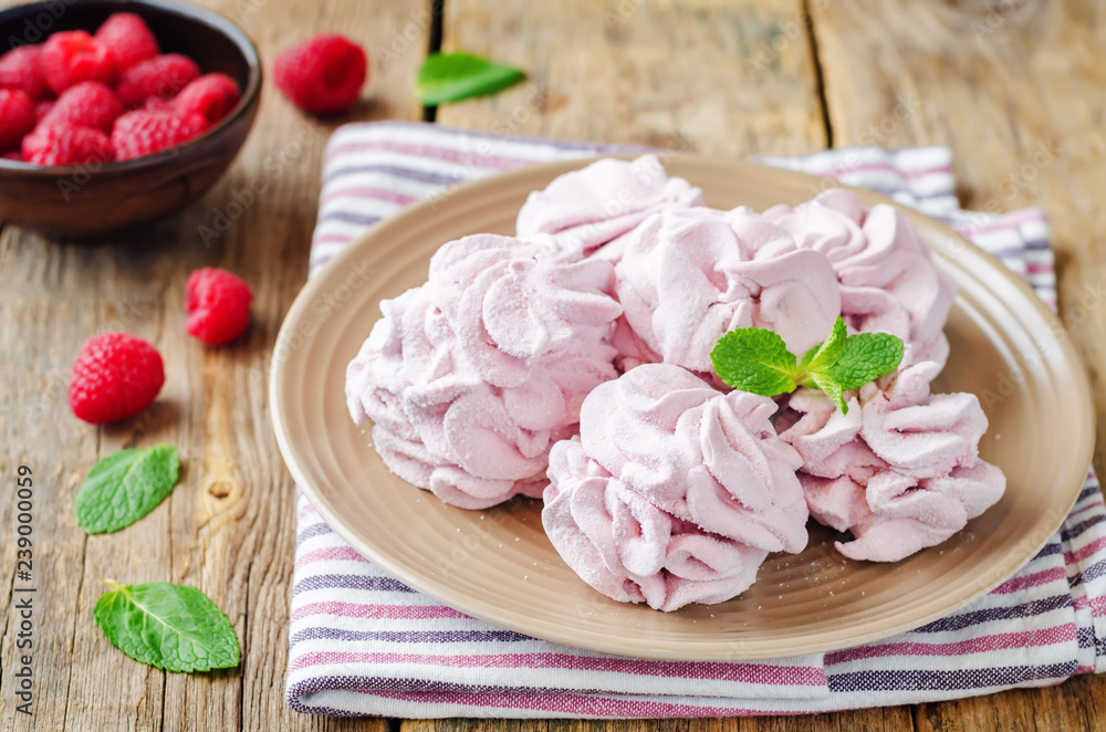 Raspberry Zephyr on a plate with fresh raspberries and mint Raspberry Zephyr on a plate with fresh raspberries and mint