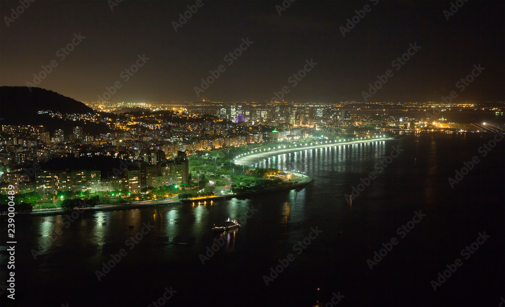 Rio de Janeiro. Brazil. Evening city. View from Sugar Loaf mountain. The night city lights flicker like millions of diamonds scattered in the hills of Rio de Janeiro.