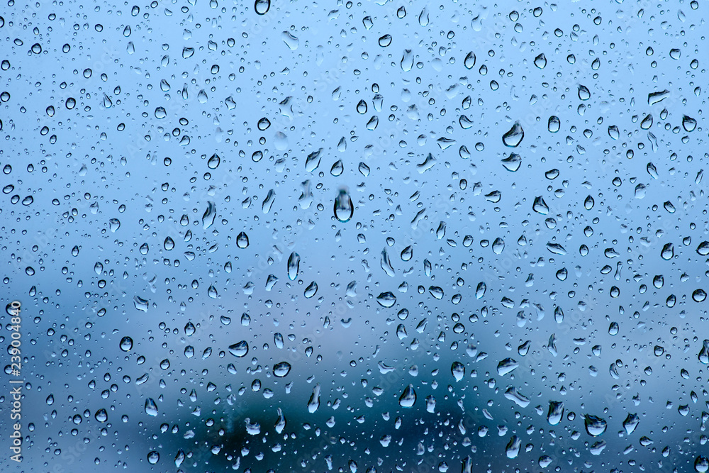 Blue tone for drops of water or rain drops on window glass
