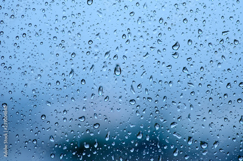 Blue tone for drops of water or rain drops on window glass