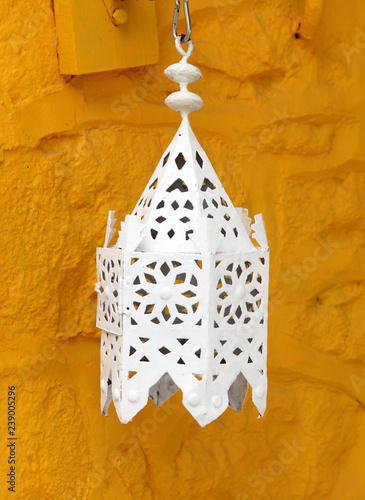 Ramadam lantern against ochre wall photo