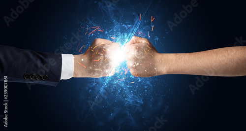 Two hands fighting with light  glow  spark and smoke concept  