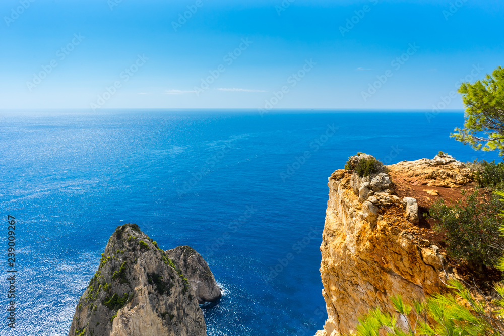 Greece, Zakynthos, No limit to the perfect blue paradise like ocean above Mizithres rock cliffs Greece, Zakynthos, No limit to the perfect blue paradise like ocean above Mizithres rock cliffs