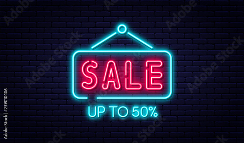 Sale neon sign, sale and discount concept. Bright and glowing neon sign for e-commerce, advertisement, banner, billboard