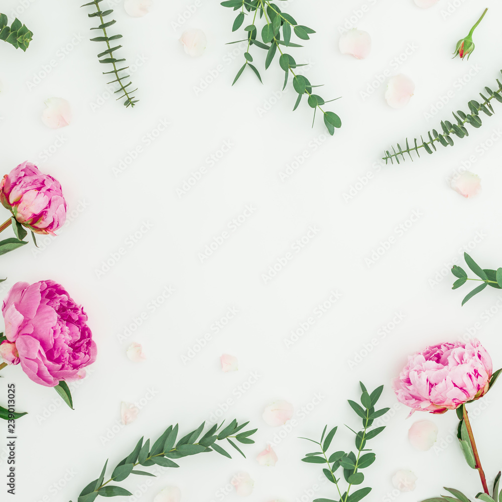 Floral round frame of pink peonies and eucalyptus branches on white background. Flat lay, top view Floral round frame of pink peonies and eucalyptus branches on white background. Flat lay, top view
