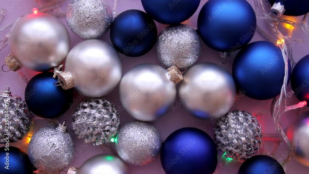 Christmas balls in blue and white colors wiht flashing lighted garland Christmas balls in blue and white colors wiht flashing lighted garland