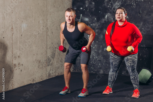 man and plump woman doing effective exercises for losing weight. full length photo. daily training for health