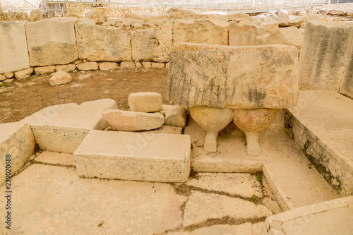 Tarxien, Malta. The ruins of one of the rooms of the ancient temple (UNESCO World Heritage List). The lower part of the statue of the Mother Goddess, 3250 - 2800 BC