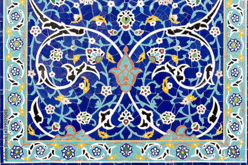 Frame of floral ceramic decoration. Colorful mosaic wallpaper. Background with islamic ornament. Mosaic blue tiles. Malaysia.
