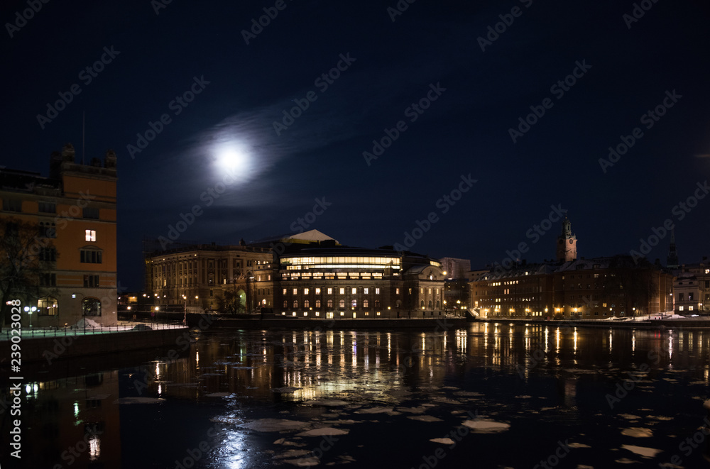 Fototapeta premium Evening view in Stockholm shilouettes of old town, parliament houses , bridges and lake Mälaren 
