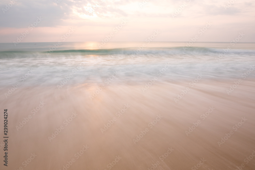 long exposure motion blur wave and morning sunrise in Chaweng beach in Samui island, Thailand
