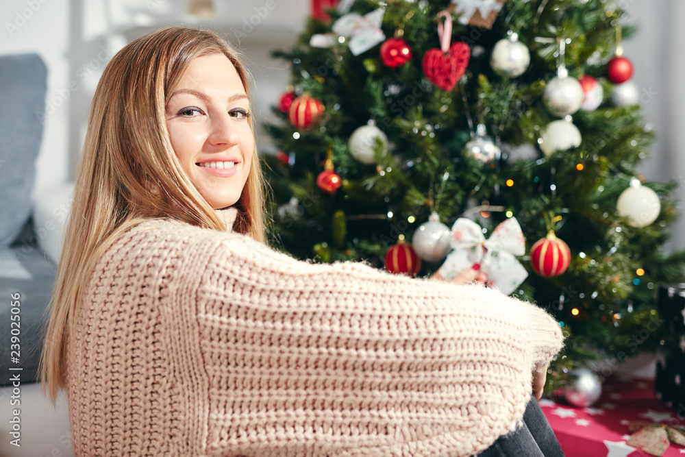 Portrait of beautiful woman enjoying Christmas eve/New Year.