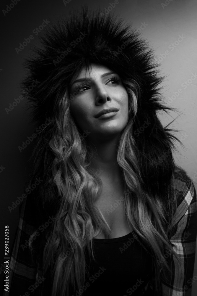 Female Posing in Studio with Women's fur shapka