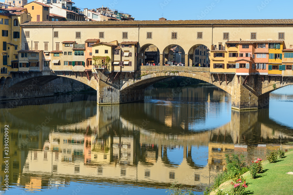 Fototapeta premium Ponte Vecchio Bridge over river Arno at sunny day. Florence. Italy