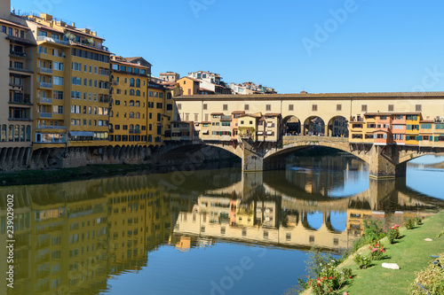 Ponte Vecchio Bridge over river Arno at sunny day. Florence. Italy