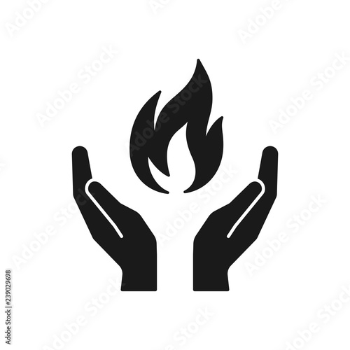 Black isolated icon of flame in hands on white background. Silhouette of fire and hands. Symbol of healing. Flat design