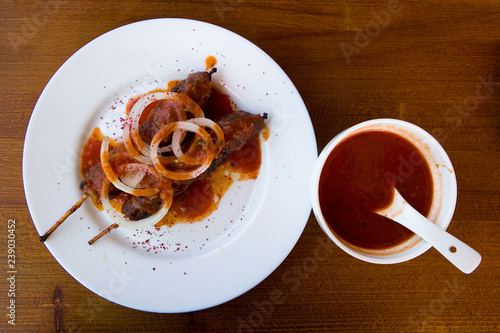 Lula kebab lie on a white plate. photo