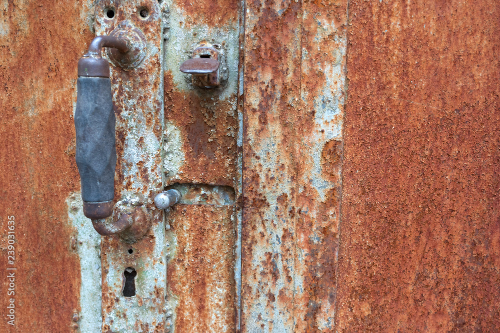 A close-up of an old rusty iron door A close-up of an old rusty iron door