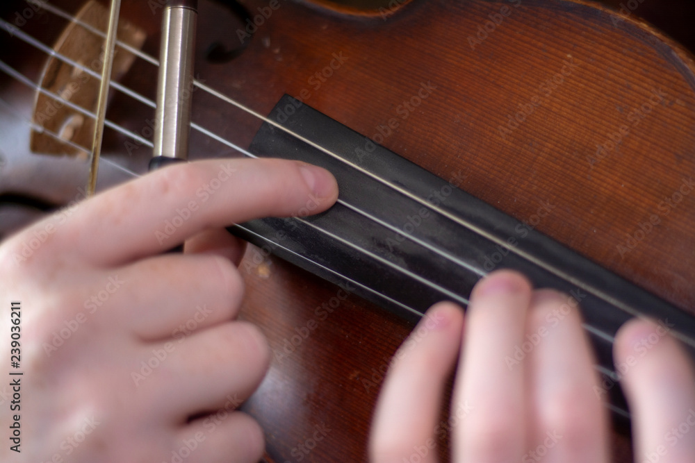 Violin girl playing pizzicato on violin Violin girl playing pizzicato on violin