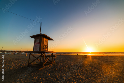 Lifeguard tower in Newport Beach shore at sunset
