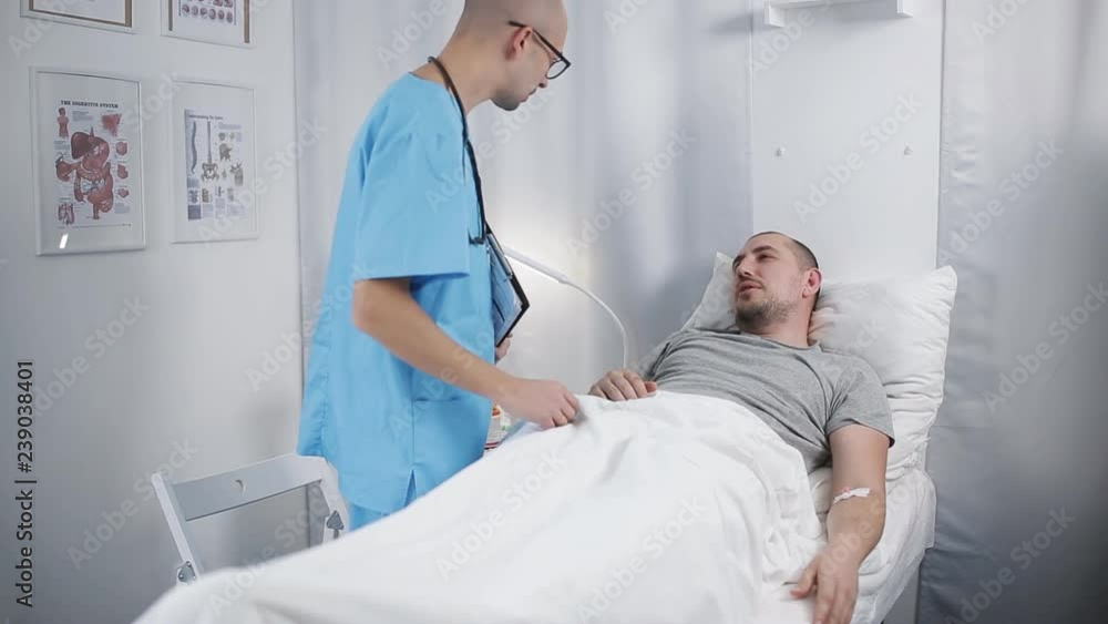male doctor examines a patient male doctor examines a patient
