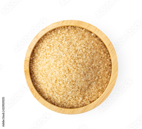 brown cane sugar in wooden bowl isolated on white background. top view