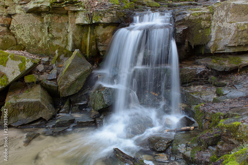 Waterfall in the forest in the spring