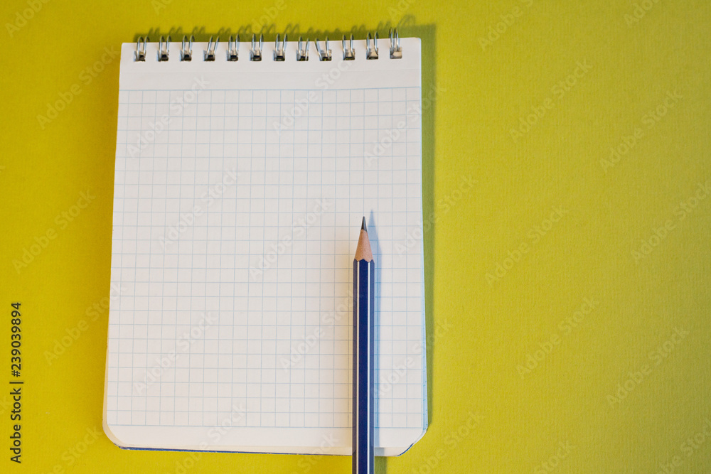 Notepad and pencil on white background Notepad and pencil on white background