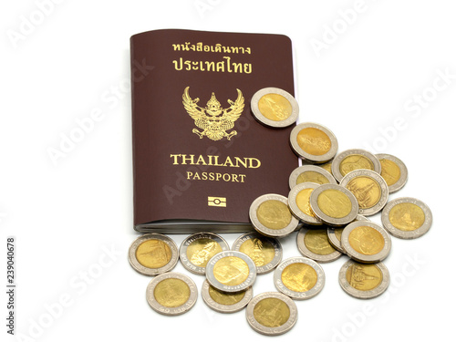 Passport cover of Thailand, Identification citizen with coins isolated on white background.