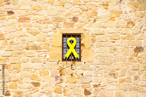 Yellow ribbon hanging out of a building in Catalonia