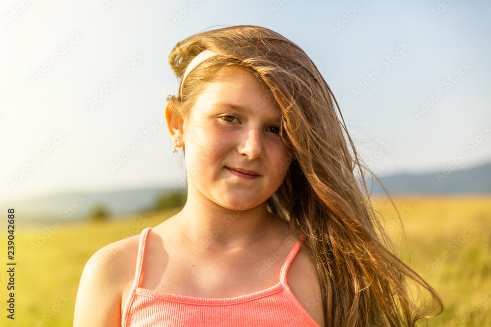 Portrait of a little girl with a shy smile