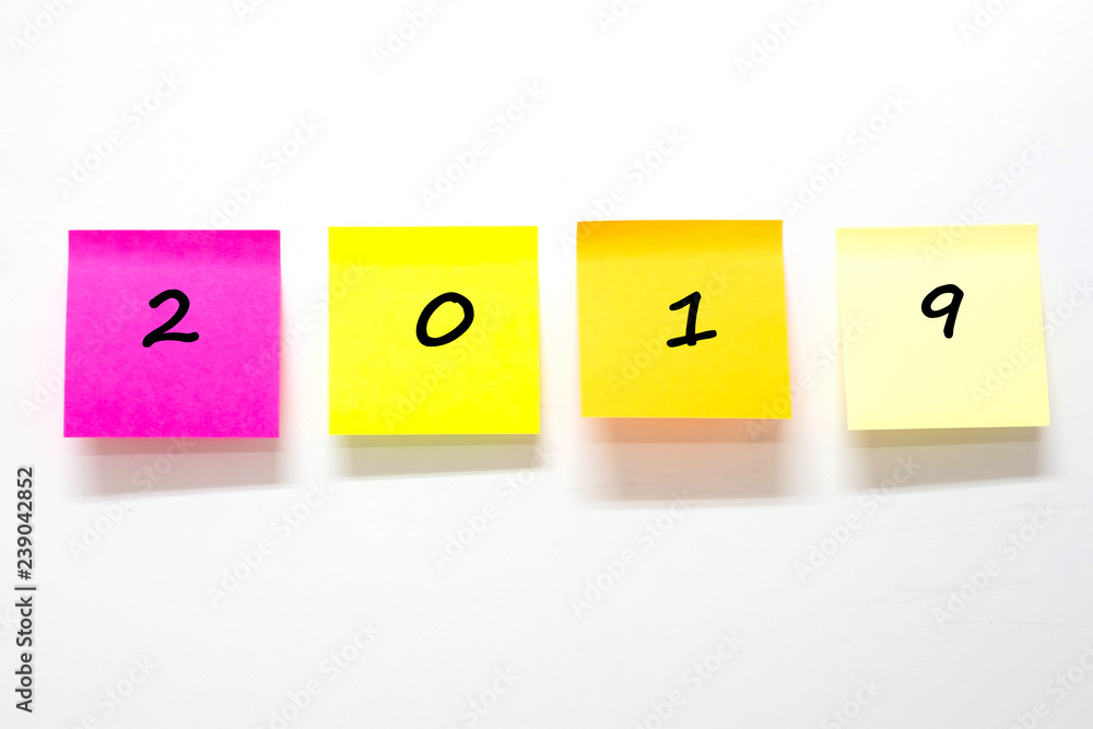 2019 text with stick note paper or post it on white background. reminder and business concept 2019 text with stick note paper or post it on white background. reminder and business concept