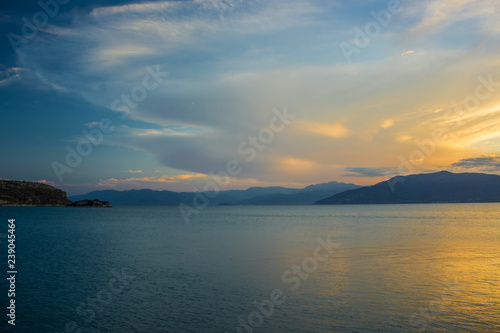 soft focus romantic nature scenery landscape of sea bay calm water surface surrounded by mountain horizon background in twilight evening sunset time wallpaper pattern with empty space for copy or text