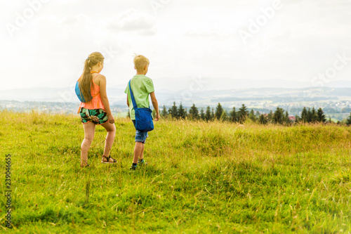 Children are walking around the park and meadow