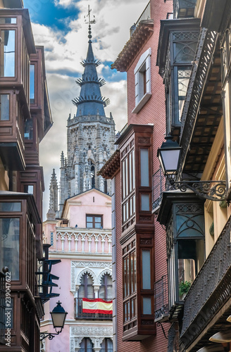 View of the cathedral bell tower from the streets of the old city center of Toledo, Castile-La Mancha, Spain